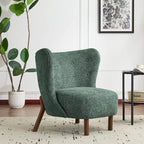 Poltroncina accentuata moderna senza braccioli Camille con seduta imbottita e struttura in legno massiccio
