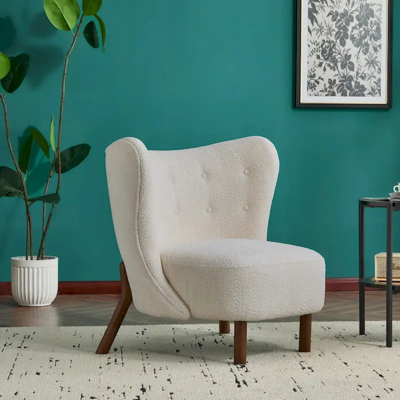 Poltroncina accentuata moderna senza braccioli Camille con seduta imbottita e struttura in legno massiccio