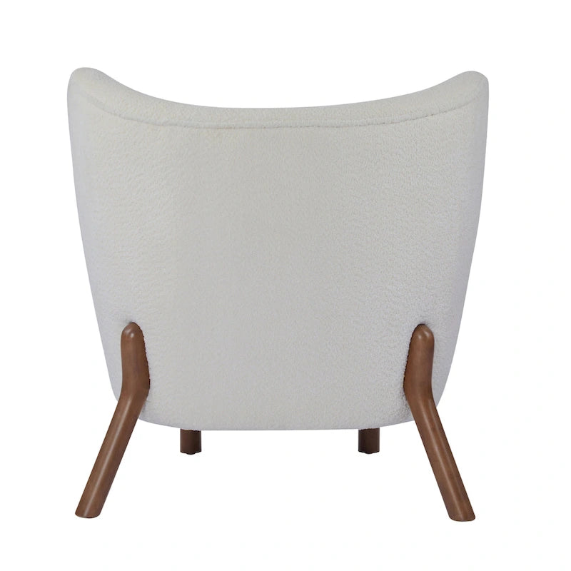 Poltroncina accentuata moderna senza braccioli Camille con seduta imbottita e struttura in legno massiccio
