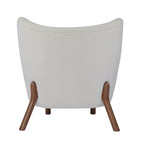 Poltroncina accentuata moderna senza braccioli Camille con seduta imbottita e struttura in legno massiccio