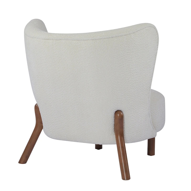 Poltroncina accentuata moderna senza braccioli Camille con seduta imbottita e struttura in legno massiccio