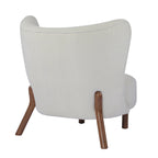 Poltroncina accentuata moderna senza braccioli Camille con seduta imbottita e struttura in legno massiccio