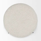 Pouf rotondo Amelia in tessuto bouclé crema con struttura in metallo nero